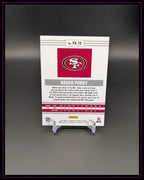 Rückseite einer NFL Trading Card von Brock Purdy, Panini, 49ers, auf Kartenständer