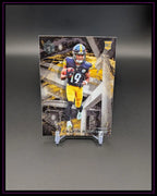 American Football Trading Card mit Spieler in schwarzer und gelber Uniform, Rookie Card Symbol sichtbar