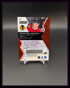 Rückseite einer Eishockey Trading Card von Ethan Del Mastro, Chicago, Rookie, auf Ständer
