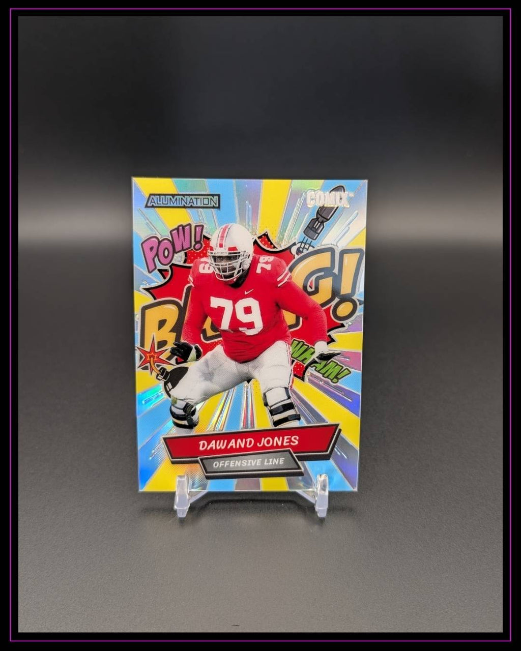 2023 Wild Card Alumination Draft #AC-12 Dawand Jones Comix Rainbow Yellow /25